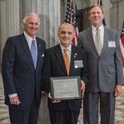 From left: Gov. Henry McMaster, Clemson University Vice President for Research Tanju Karanfil, and Bob Quinn, executive director of the South Carolina Research Authority, pose for a photo at the South Carolina capitol. 