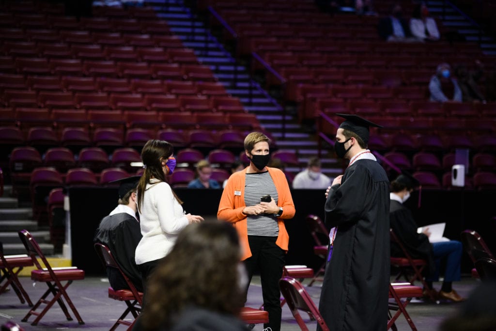 Kristi Cox, Pam Davis speak with a Clemson graduate during a December 2020 ceremony
