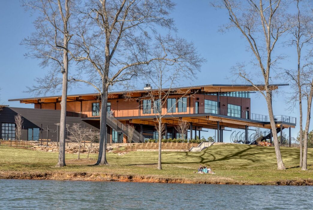 Outdoor view of the rear elevation of the Andy Quattlebaum Outdoor Education Center with the Lake Hartwell shoreline in front of it.