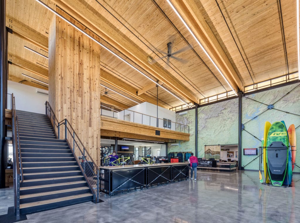 Andy's lobby is very open and airy with cross-laminated Southern yellow pine on the ceiling and on one side of an open staircase leading to a second level