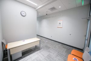 Interior Garrison Sales Lab space showing chairs, a bench and clock