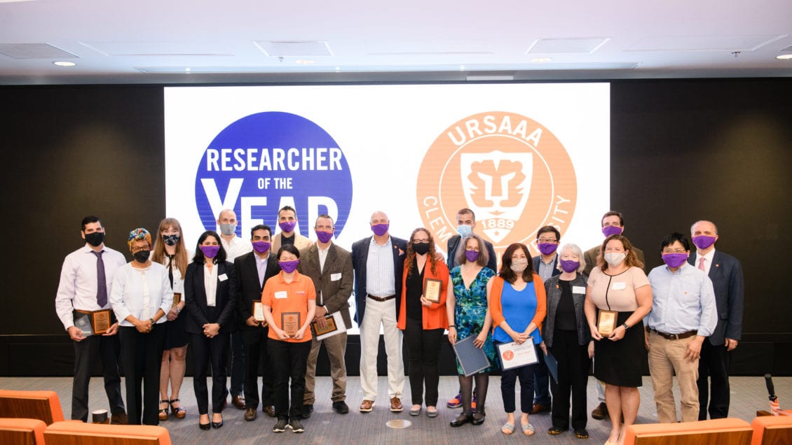 Researcher of the Year nominees and recipients of the University Research, Scholarship and Artistic Achievement Awards gather for a group photo with Clemson University President Jim Clements, center.