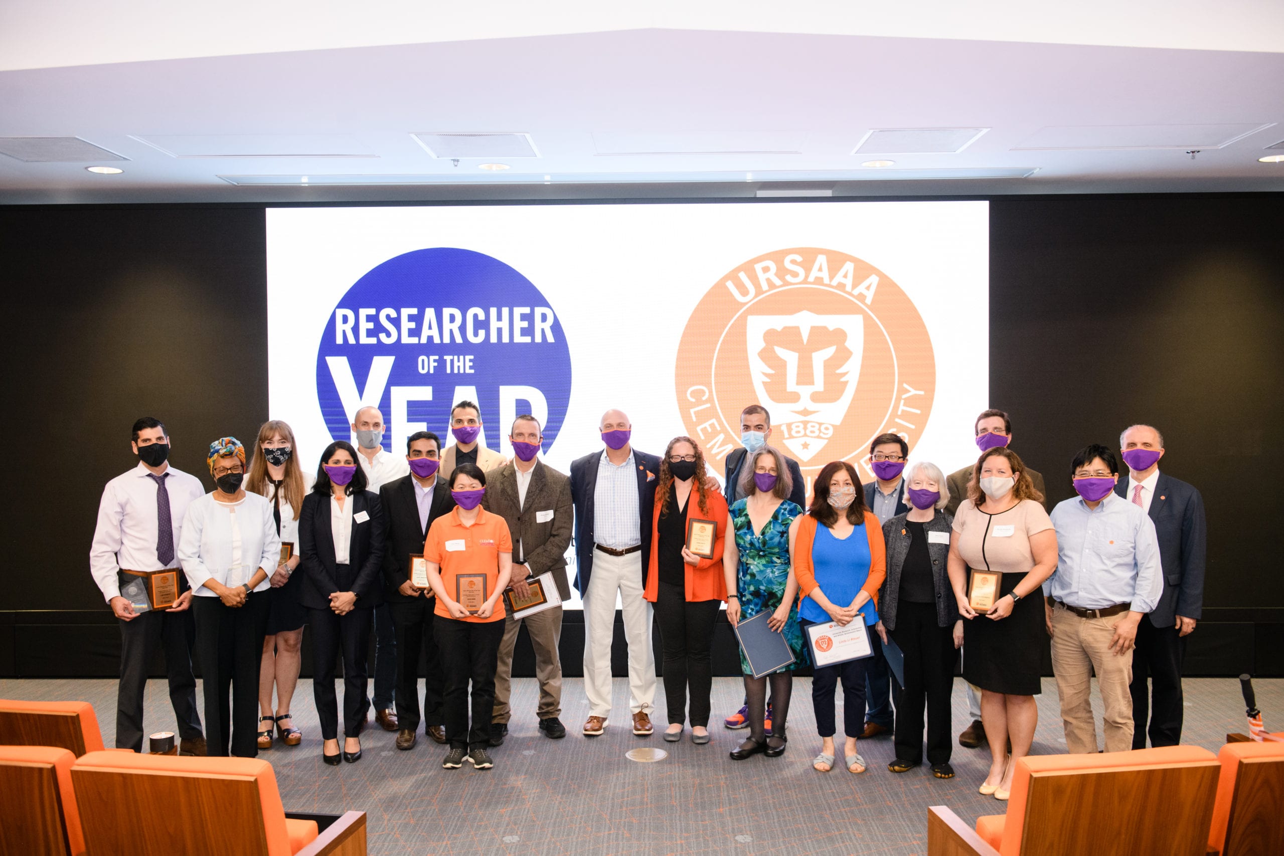 Researcher of the Year nominees and recipients of the University Research, Scholarship and Artistic Achievement Awards gather for a group photo with Clemson University President Jim Clements, center.