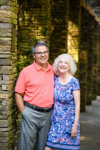 Debbie and Vince Jackson stand side-by-side smiling towards the camera.