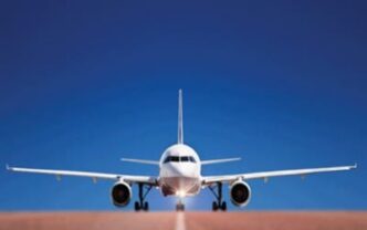 A passenger jet on the runway awaiting takeoff.