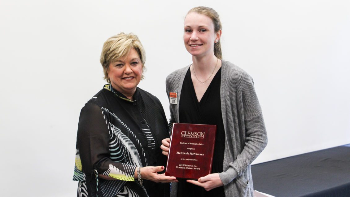 McKenzie McNamara (right) receives the 2019 Walter T. Cox Graduate Student Award from then Vice President for Student Affairs Almeda Jacks