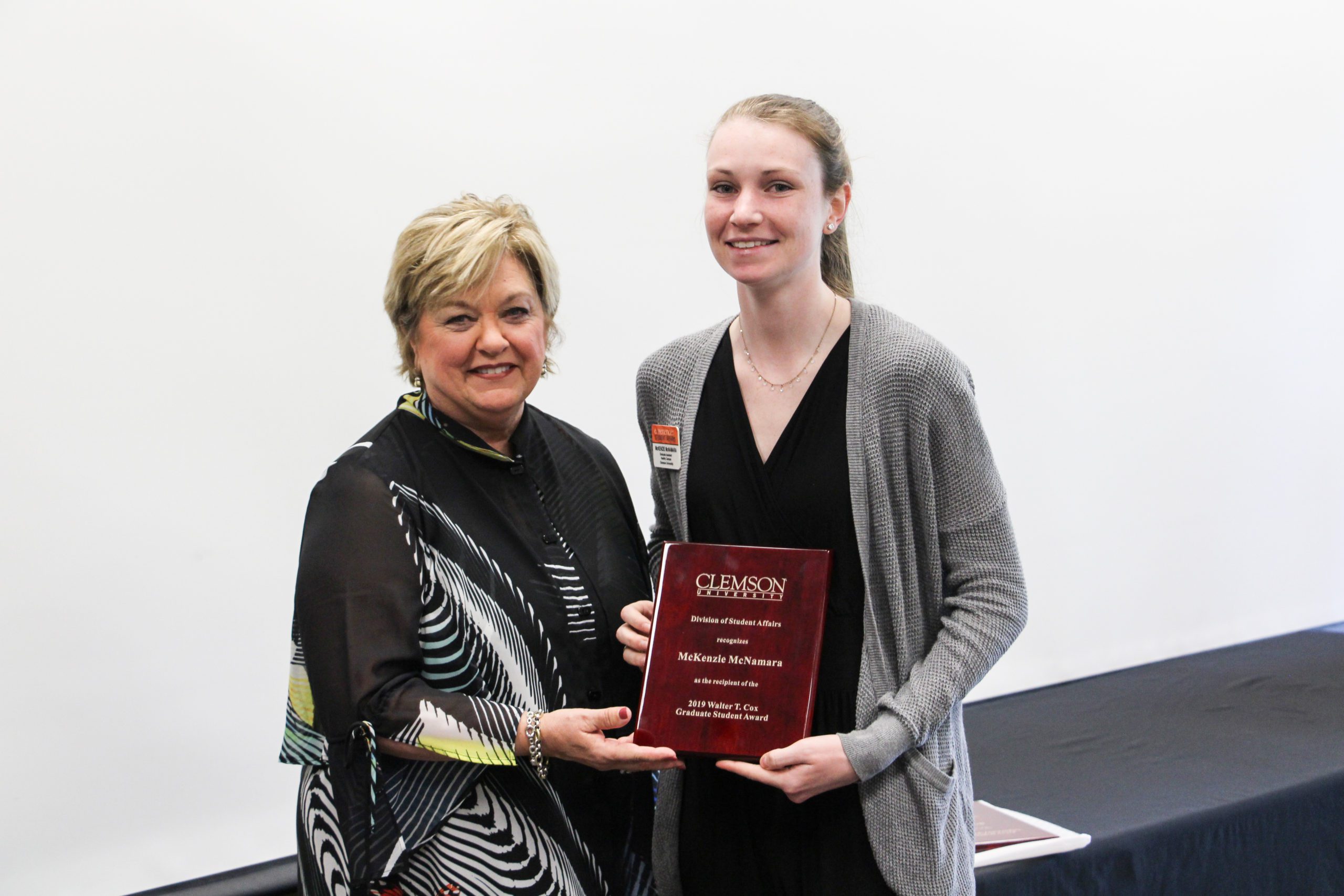 McKenzie McNamara (right) receives the 2019 Walter T. Cox Graduate Student Award from then Vice President for Student Affairs Almeda Jacks
