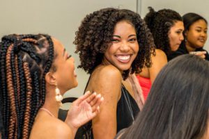 Black woman smiling during an event