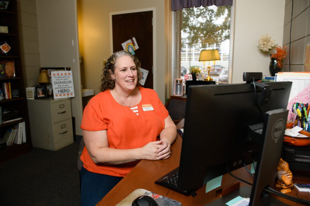 Amy Massingill, assistant director of Counseling and Psychological services, conducts a telehealth visit from her office