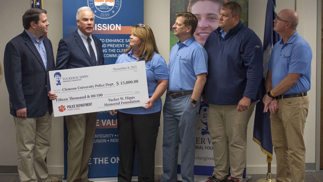 Associate VP for Public Safety Greg Mullen and Assistant Dean of Students Gary Wiser join members of the Tucker Hipps Foundation for an announcement $15,000 will be contributed to a campus hazing awareness campaign