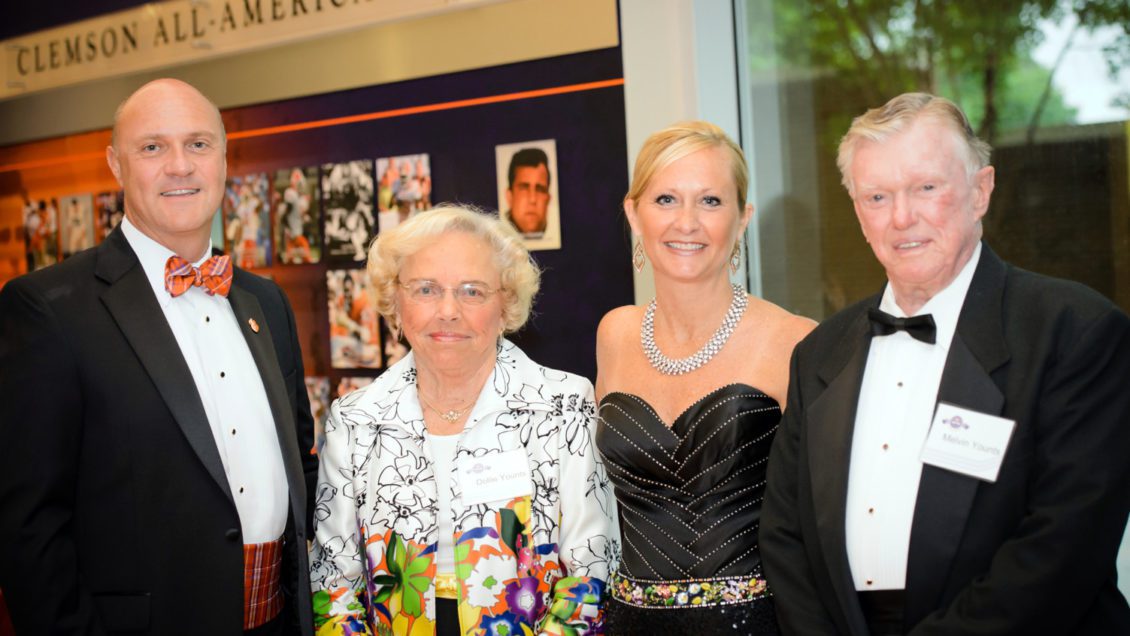 Image of Melvin and Dollie at formal event with President Clements and First Lady Beth Clements.