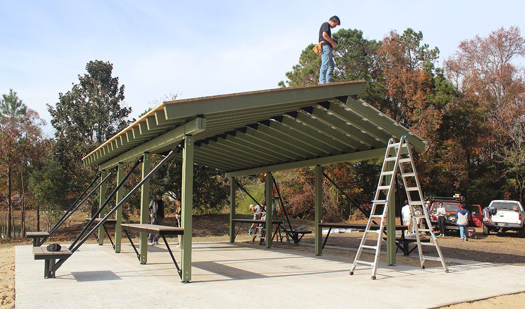 students construct a pavilion in a park in Charleston