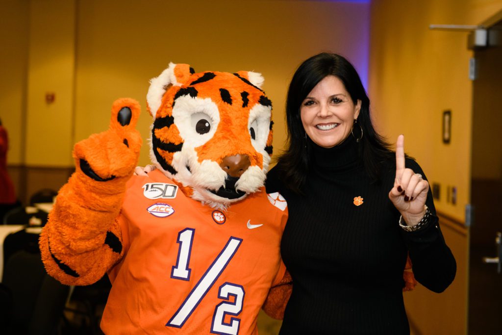Kryssa Cooper, pictured with the Tiger Cub at a 2019 Student Affairs function, has been promoted to assistant vice president for brand strategy and community engagement