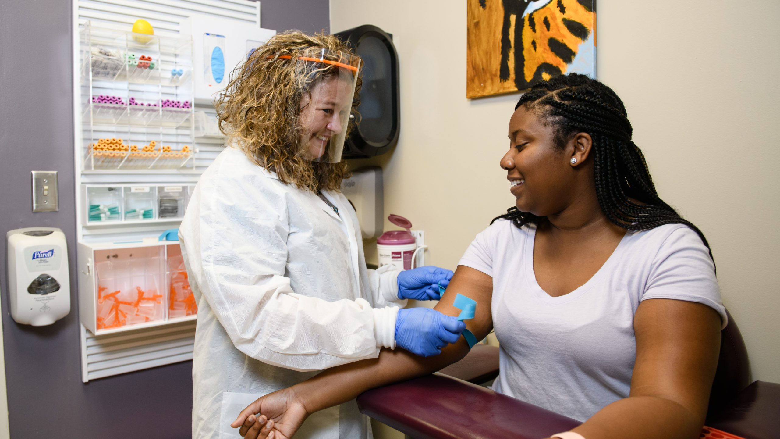 Mary Stuart Turner, laboratory supervisor at Redfern Health Center, works with a student in Fall 2021