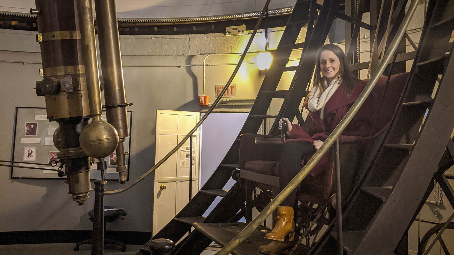 Jordan Eagle, a Ph.D. candidate in the Clemson University Department of Physics and Astronomy, sits in the refractor at the Harvard Smithsonian Astrophysics Center.