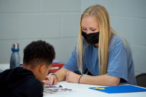 A Clemson student works with a student at the Littlejohn Community Center