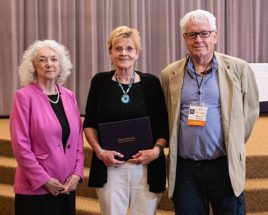 Elaine Richardson receives the Kenelly-Voss Distinguished Emeritus Award from Debra Jackson and Robert Hogan.