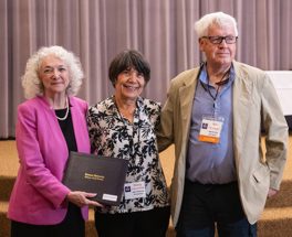 Marty Duckenfield (center) receives the I. Dwayne Eubanks Fellow Award from Debra Jackson and Robert Hogan.