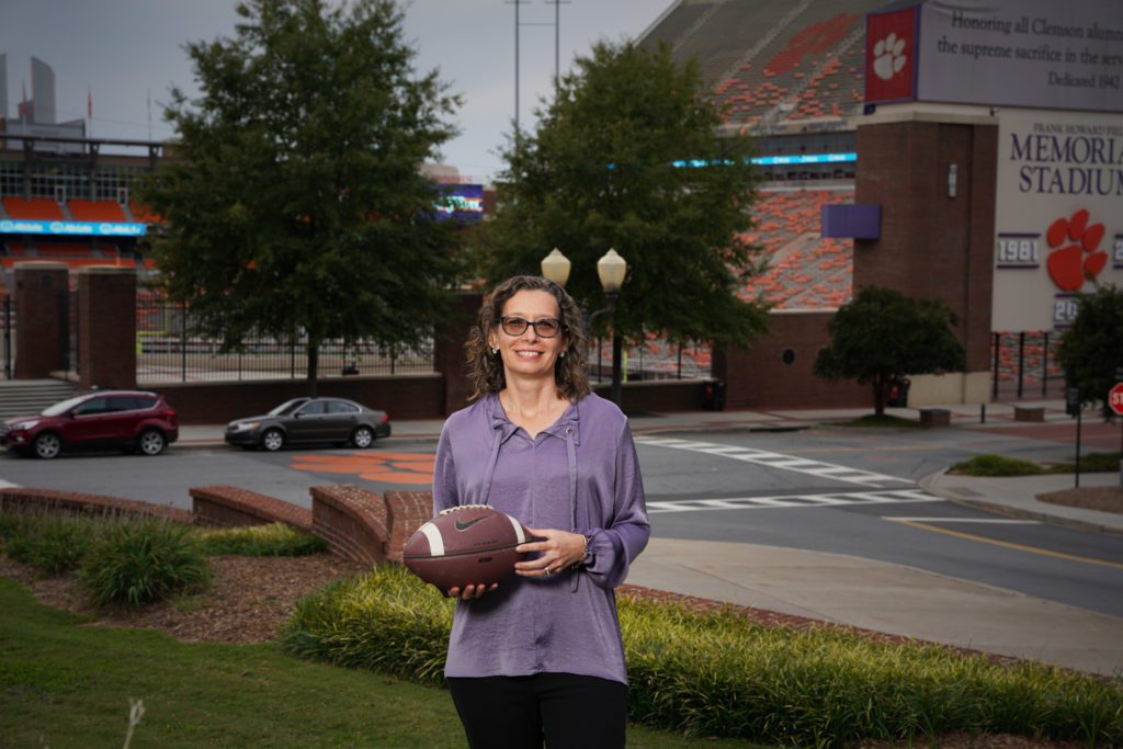 Amy Pope standing in front of Memorial Stadium
