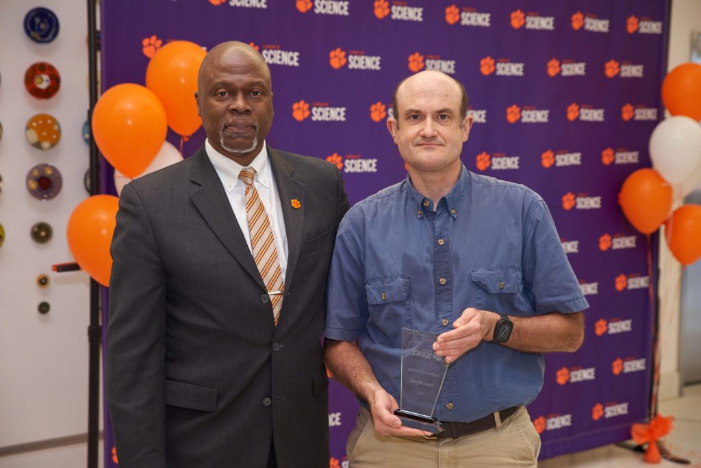 Calvin Williams and Jason Brown pose after Brown won the College of Science's Excellence in Teaching Award.