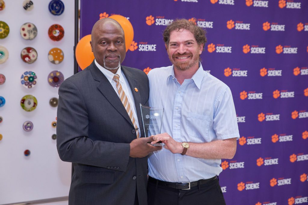 College of Science associate Dean Calvin Williams poses with Jeff Anker, winner of the College of Science's Excellence in Discovery Award for 2022.