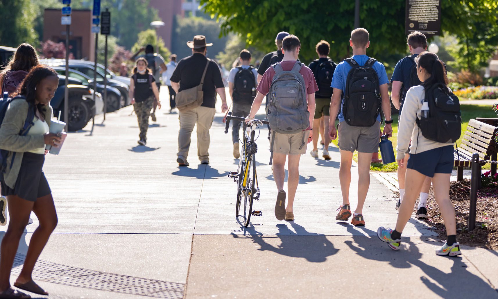 Students walking away from the camera outside. Spring 2022 President's List.