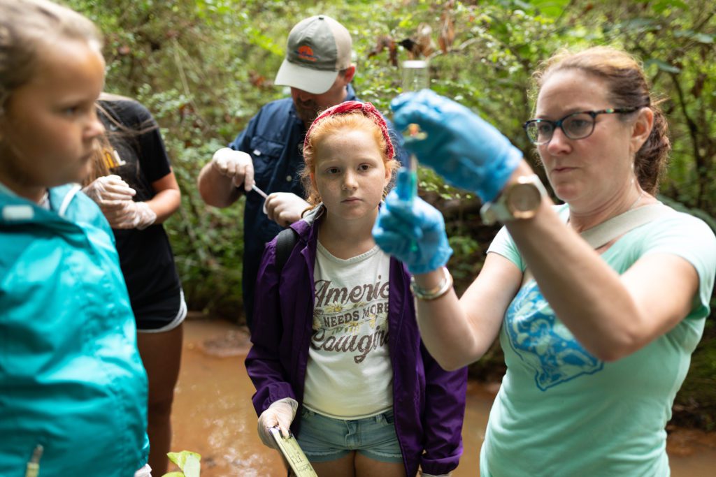 Adopt-a-Stream director Katie Callahan teaches children now to sample water.