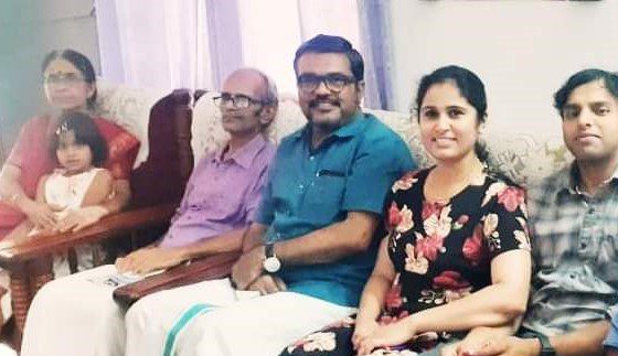 Image from her parents house in India. Pictures are (from left): her mother, Sreedevi Narayanan Kutty; her daughter, Mizhi; her father, Narayanan Kutty; honorary speaker of the Kerala Legislative Assembly in India, M B Rajesh; Sruthi Narayanan and her husband, Predeesh Chandran.