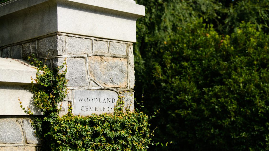 The stone gateway marker to Woodland Cemetery.