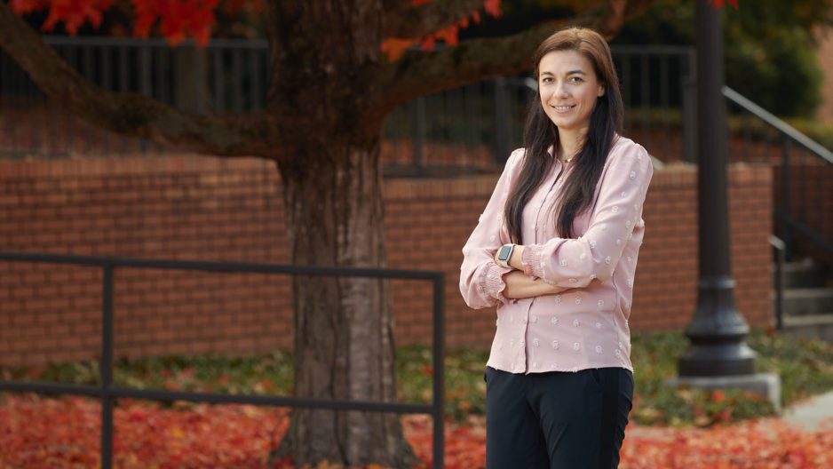 A portrait of Eva Murphy, recipient of the Kenyon Fairey Award, posing in front of a tree on Clemson University's campus.