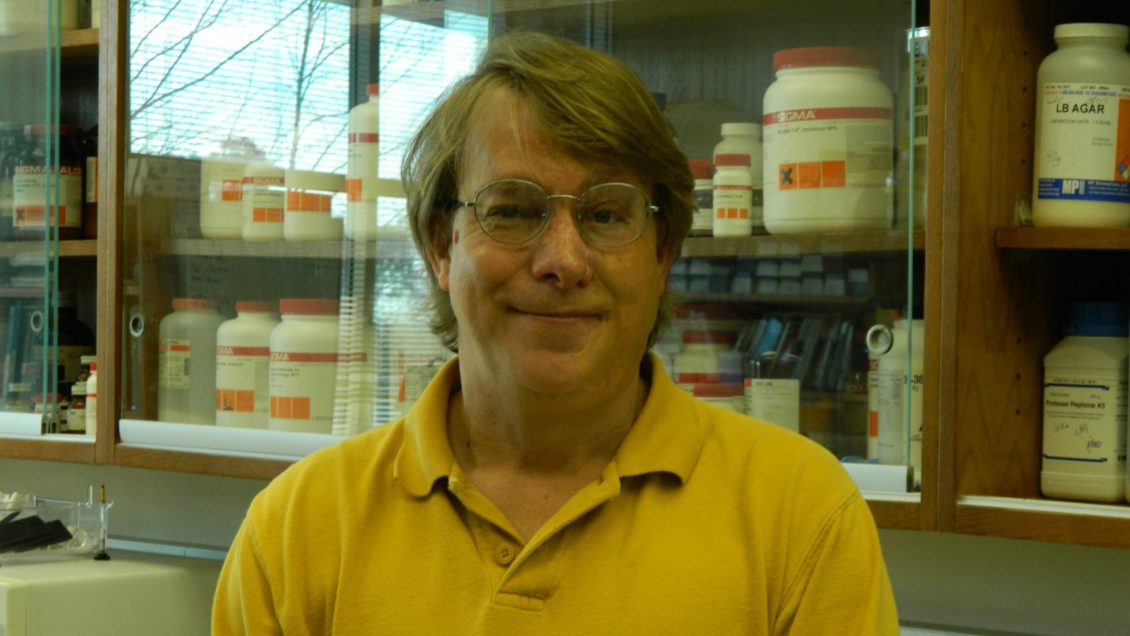 Patrick Wechter, Director of Clemson University's Coastal Research and Education Center, standing in front of cabinets filled with supplies.