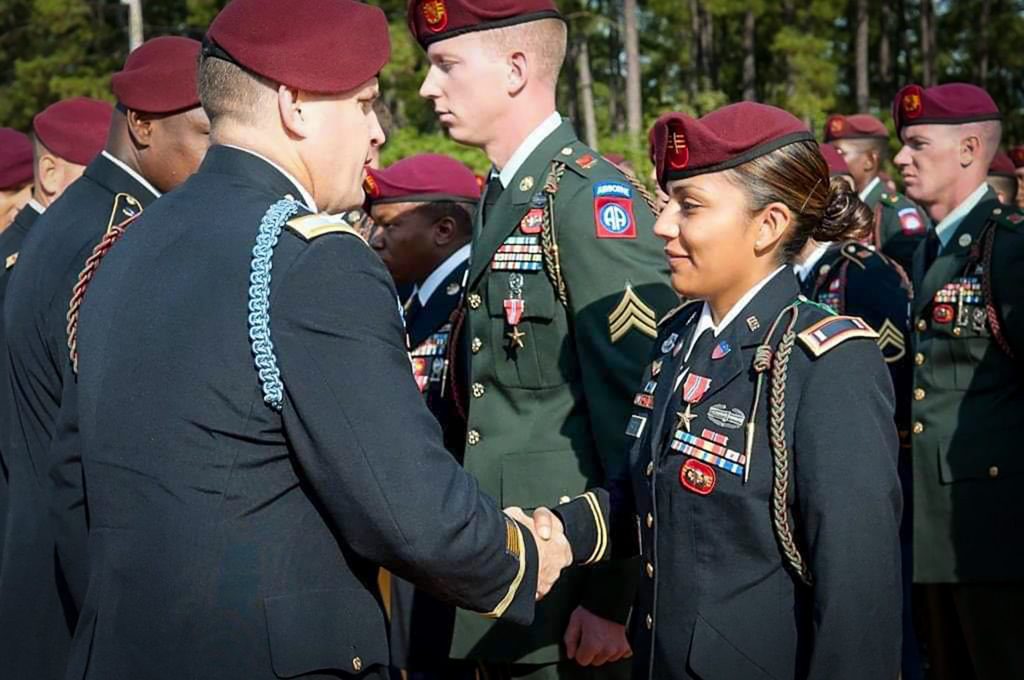 Lt. Maira Patino, and other service members in Army uniform, receiving the Bronze Star medal in a ceremony at Fort Braggs after returning from Afghanistan.