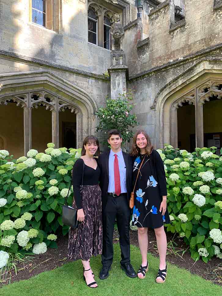 Sergio Gonzalez-Varela posing with two students in his Shakespeare course, both of whom are from the University of Michigan.