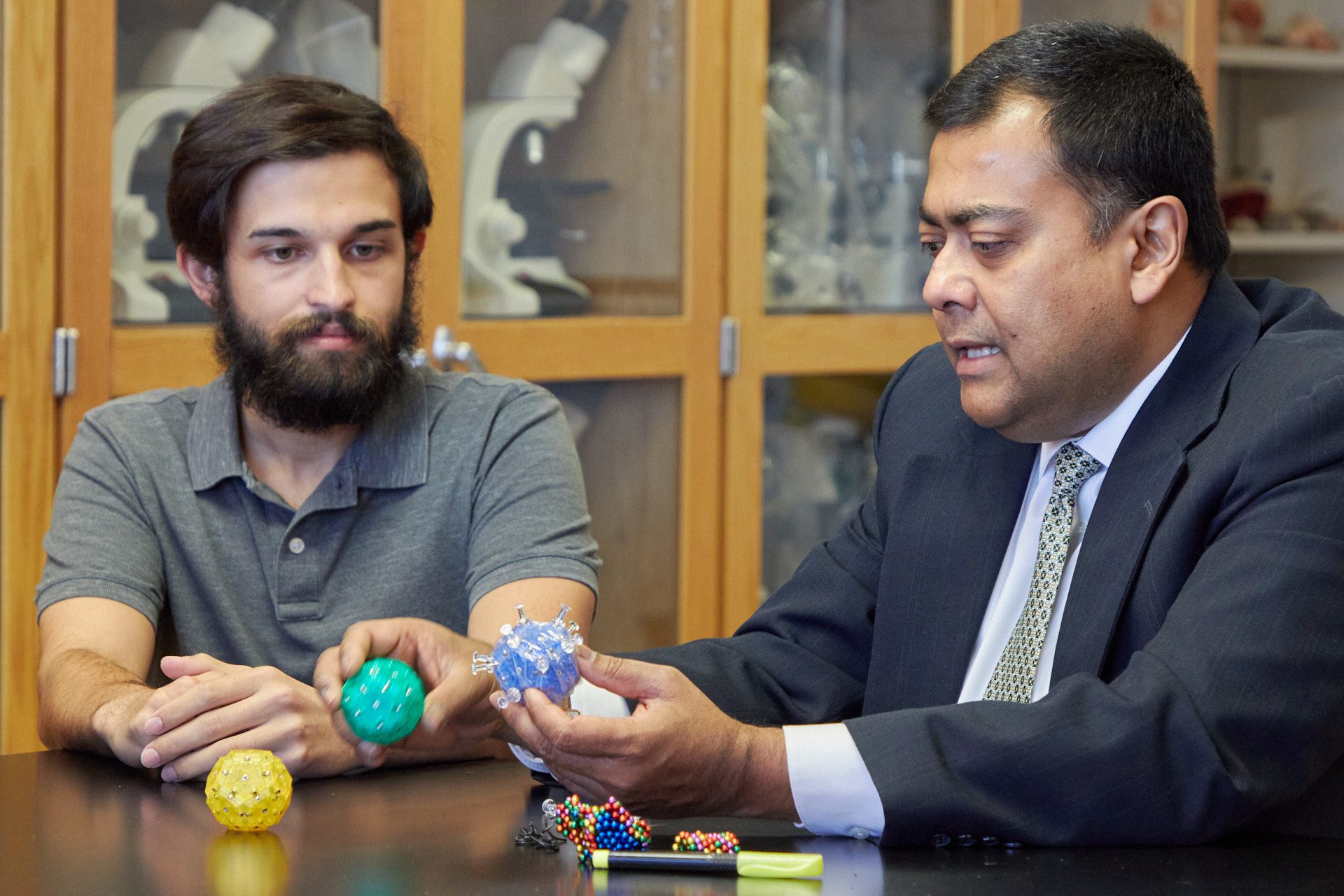 Kaustubha Qanungo, a lecturer in the Clemson University College of Science, uses magnetic fidget toys to help teach the structure of viruses to his Introduction to Virology class