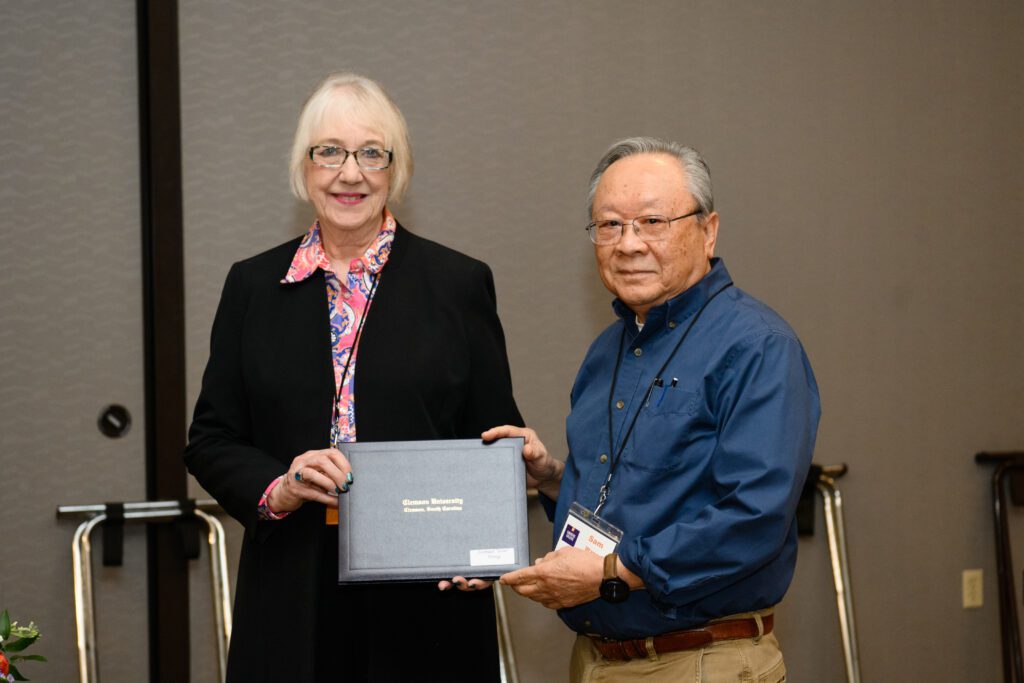 Sam Wang accepts an award