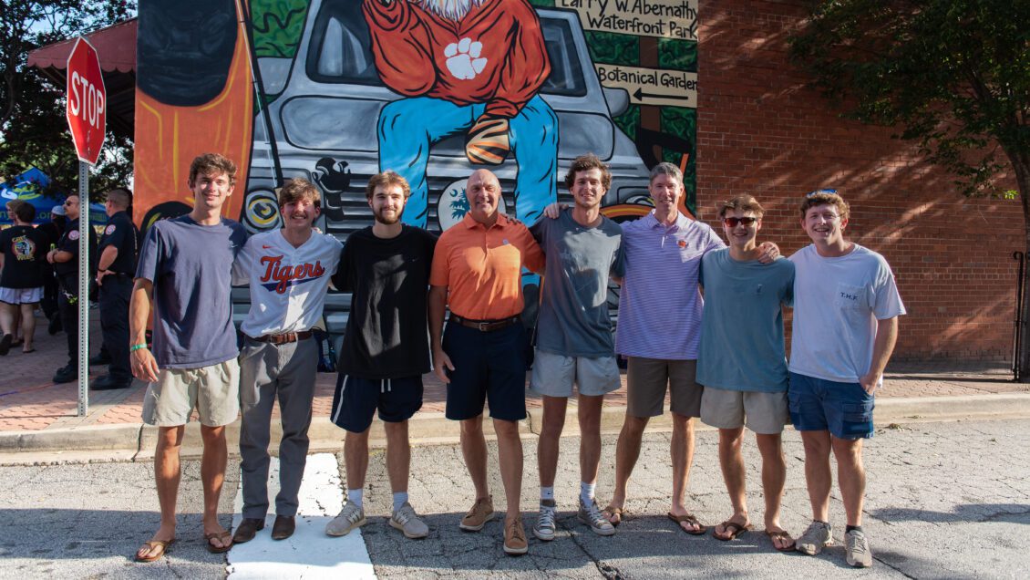 President Jim Clements and Mayor Robert Halfacre with students in downtown Clemson