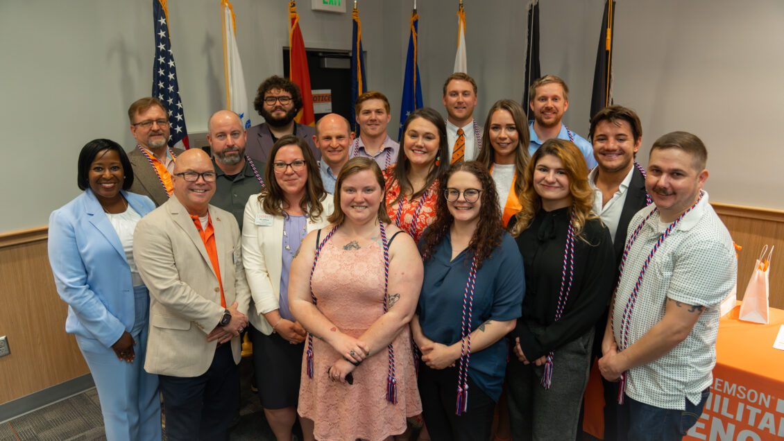 Graduating student veterans and service members celebrate with Clemson University staff after a luncheon in May 2023