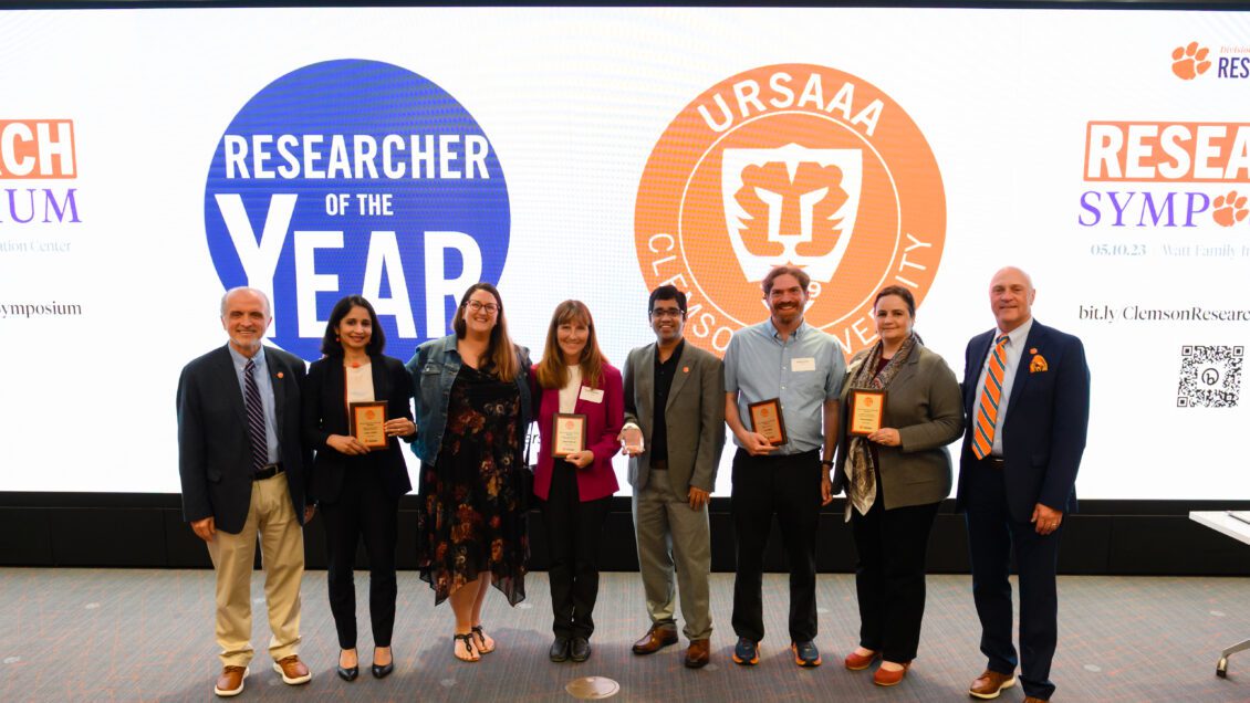A group of people pose for a photo at the Researcher of the Year award ceremony.