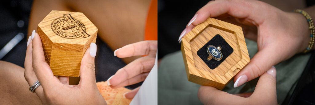 Two close-up photos of women holding their class ring boxes - the first with the lid on, and the second with the lid off and 2022 class ring visible.
