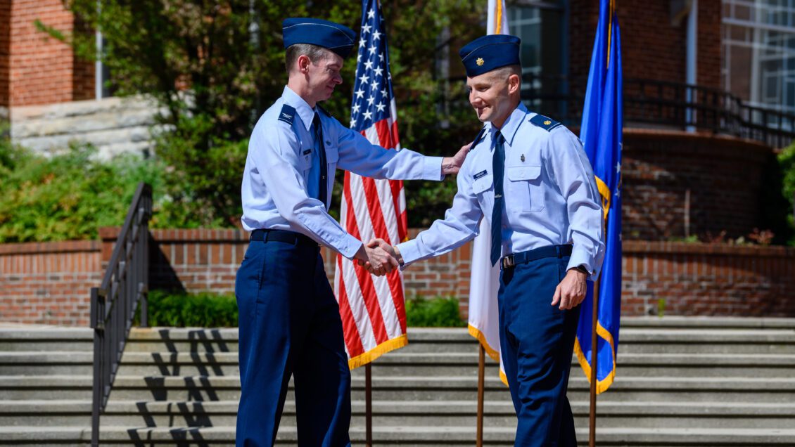 Christopher Mann congratulates Andrew Anspach on his U.S. Air force promotion in June 2023