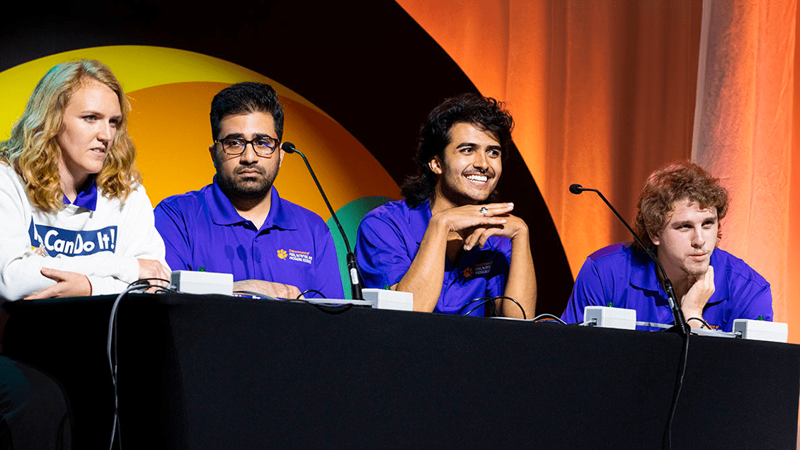 Winning team shown on stage during college bowl