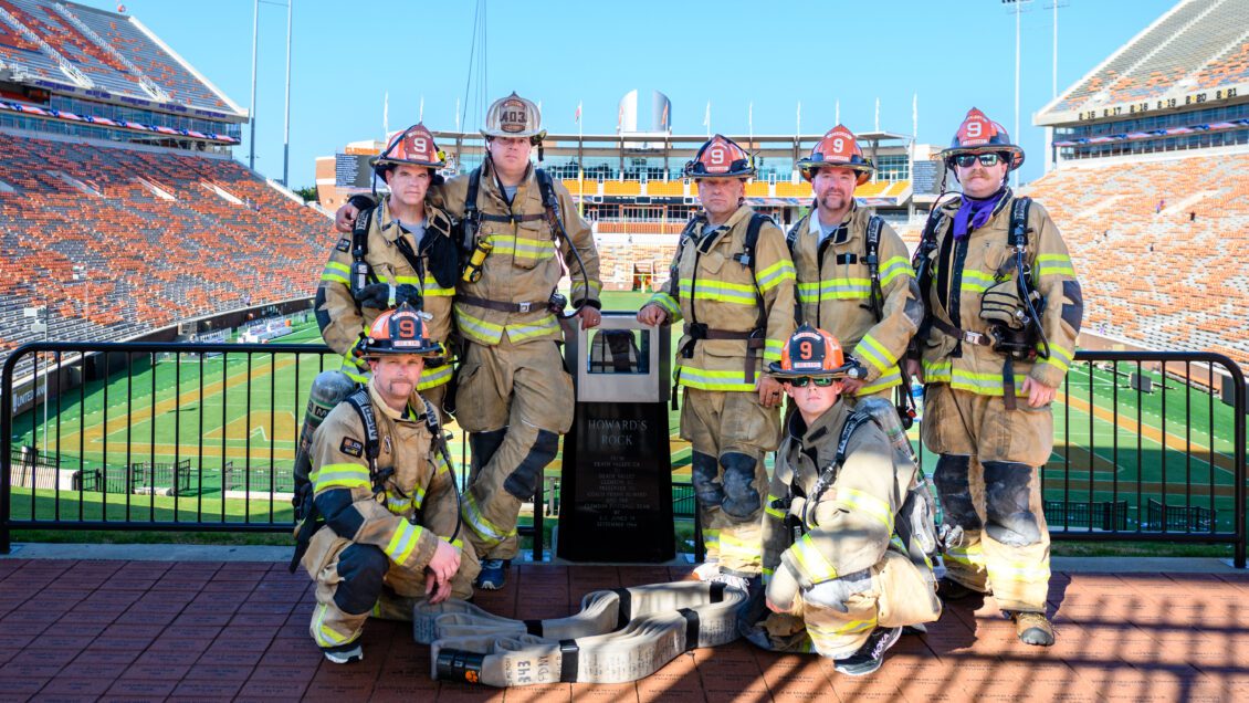 Members of Clemson University Fire & EMS gather for a photo at Howard's Rock after taking part in the Memorial Stadium Stair Climb as part of the 9/11 remembrance event