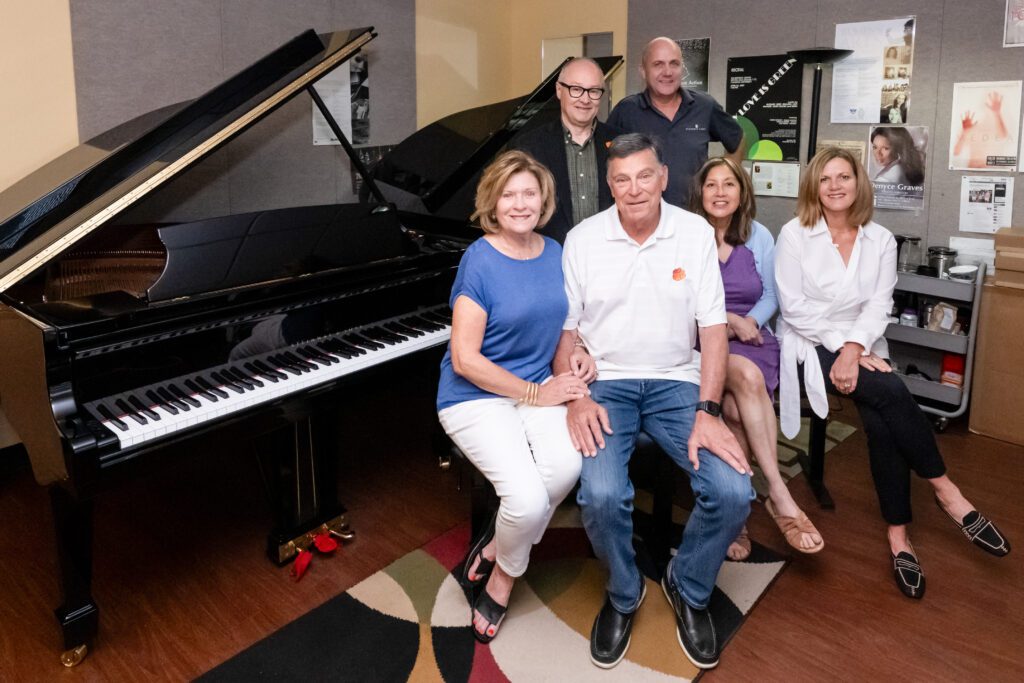 A group of people sit in front of a Steinway & Sons piano at the Brooks Center for the Performing Arts.
Back row: Nicholas Vazsonyi (Dean of Arts and Humanities) and Mark Love (Steinway & Sons).
Front Row: Kaye Stanzione (Clemson alumna), Bob Stanzione (Clemson alumnus), Linda Li-Bleuel (Professor), and Amy Vogelgesang (Clemson University giving).