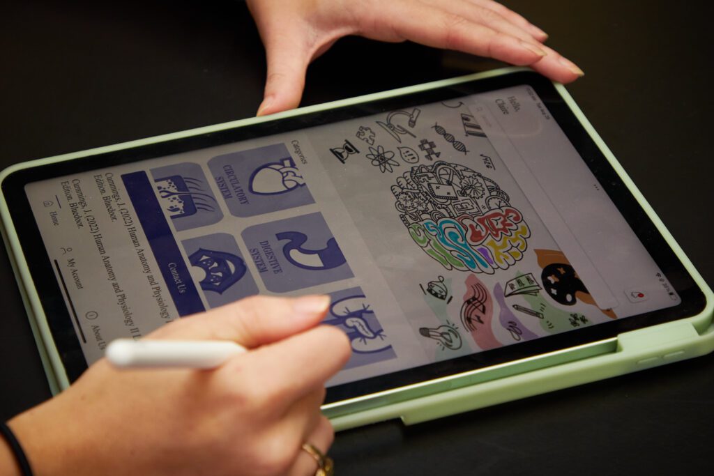 An app showing a diagram of the human anatomy showing on the screen of a tablet