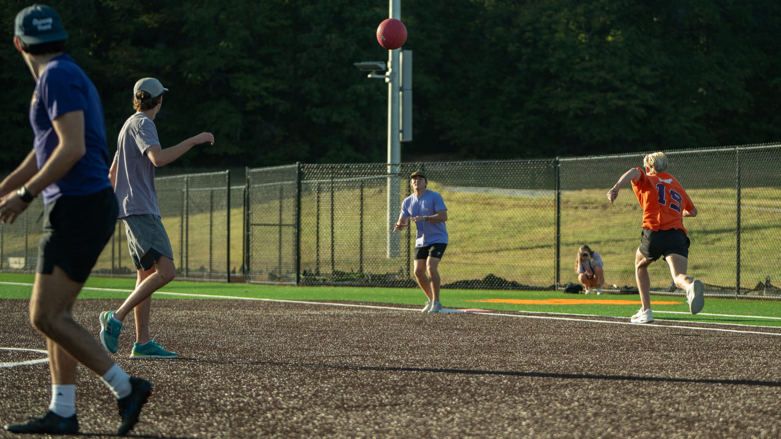 Students participate in intramural kickball at Reed Family Field at the Snow Complex