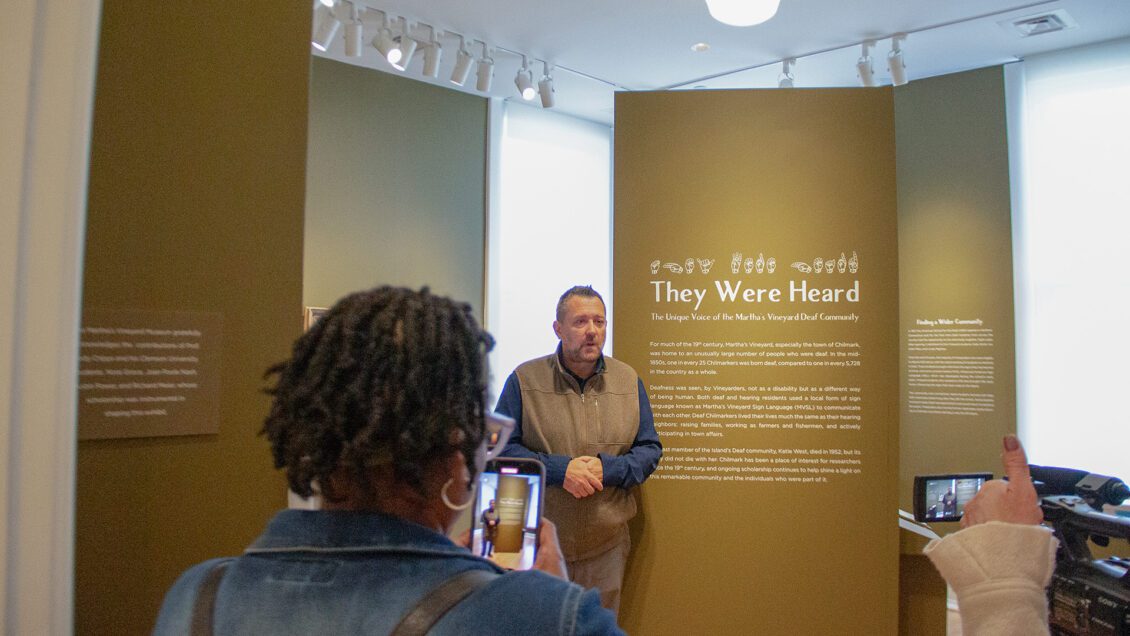 Jody Cripps is filmed while explaining the "They Were Heard" exhibit in the Martha's Vineyard Museum.