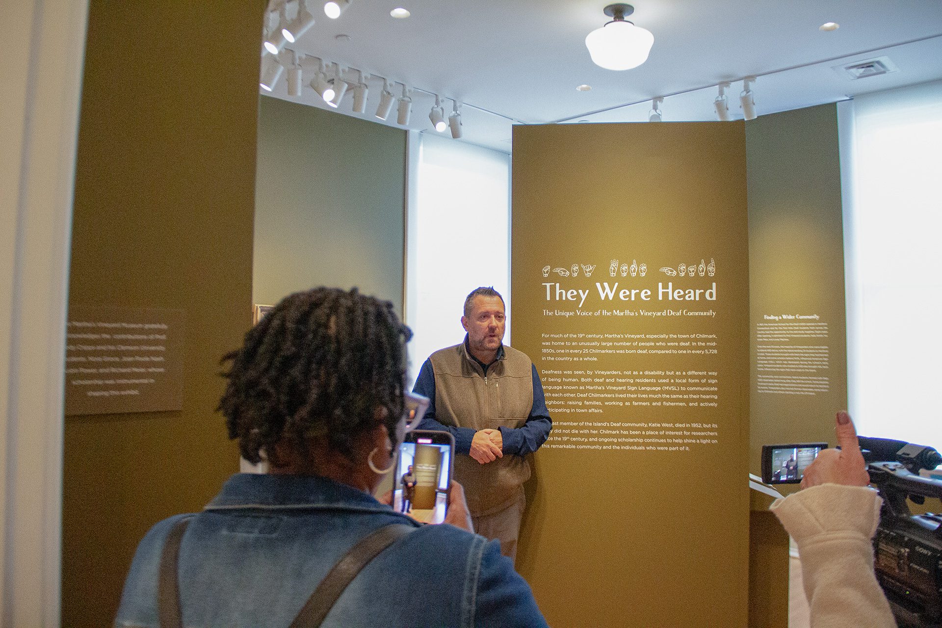Jody Cripps is filmed while explaining the "They Were Heard" exhibit in the Martha's Vineyard Museum.