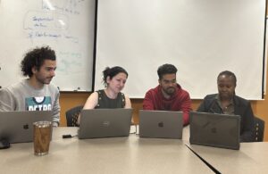 From left: Mostafa Saberia, a doctoral student in Civil Engineering;, Vidya Samadi, professor; Praneeth Dulam, a master's student in Computer Science and Lisa Umutoni, a doctoral student in Agricultural Sciences, analyze data to use for developing a flood evacuation tool for South Carolina residents.