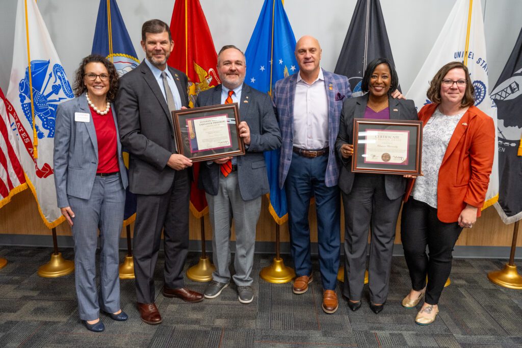 Members of the Office of Human Resources and Division of Student Affairs pose with the SC Secretary of Veterans Affairs and President Jim Clements.