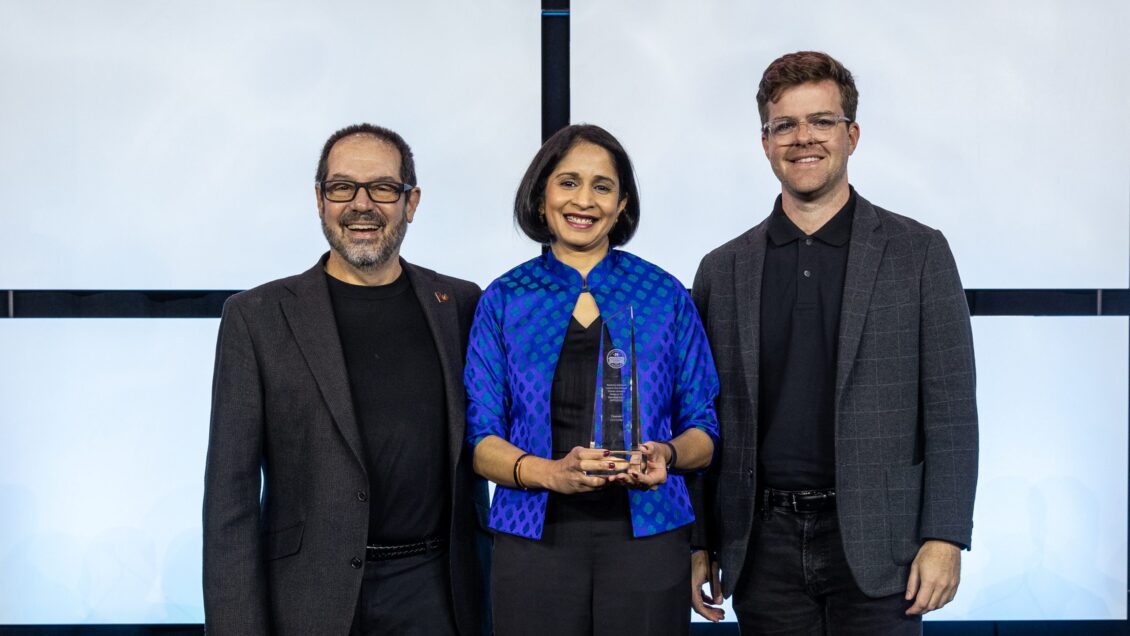 David Allison (left), Anjali Joseph (middle) and Austin Ferguson stand on stage at CHD accepting their Platinum Award.